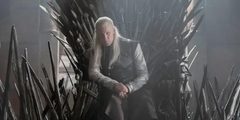 Daemon Targaryen sedící na Železném trůnu